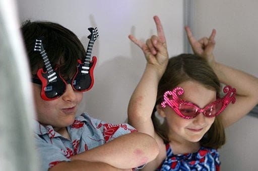 two kids wearing cute kiddie eyewear and enjoying it