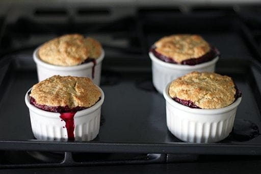 4 pieces Saskatoon Cobbler on ramekins with biscuit topping