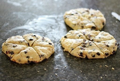 Flatten mixture of Saskatoon Berry Scones shaped into disk and cut into 6 equal triangles