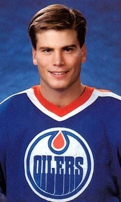 Edmonton oiler wearing blue oilers shirt uniform