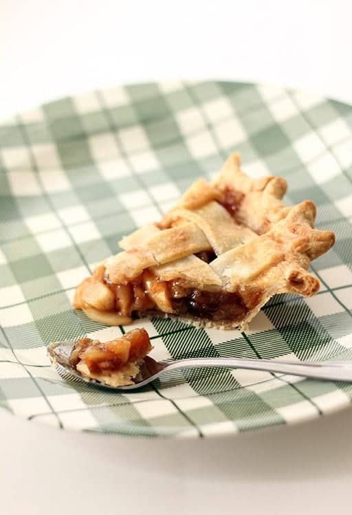 spoon with Amaretto Raisin Crabapple Pie in a checkered green plate