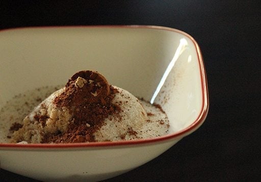 mixing together the dry ingredients in a white bowl