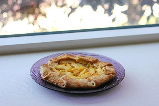 Peach Galette in a plate near the window