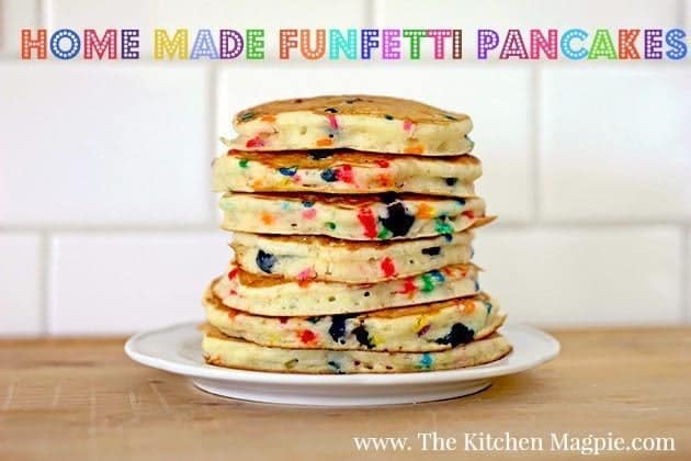 stack of bright and colorful Funfetti Pancakes in a white plate