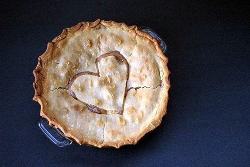 whole peaches and cream pie in a Pyrex pie plate