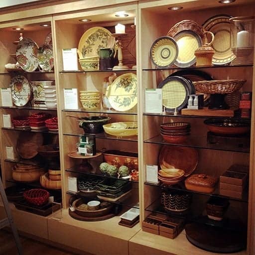 a wall with a collection of pie plates like Emile Henry artisan ruffled pie dishes