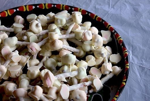 coated Pretzel and Marshmallow Bones - marshmallow stuck on each end of a pretzel