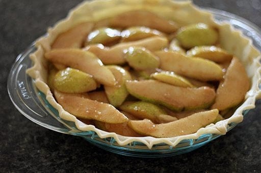 Sliced pears tossed with sugar,cornstarch,spices and rum then layered in a pie crust