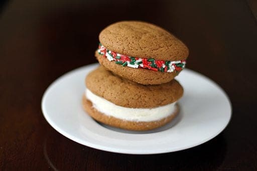 2 pieces of Ginger Cream Christmas Cookies in a white plate
