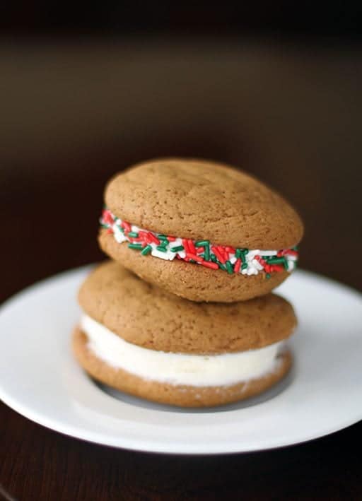 plain and colorful sprinkled Christmas cookies in a white plate