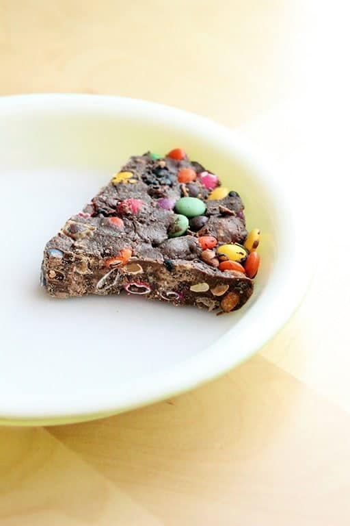 a slice of Leftover Halloween Candy Pie in a white plate