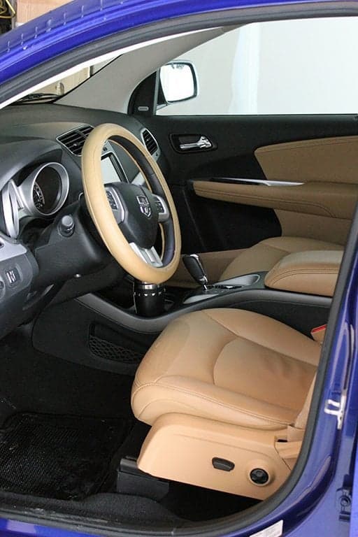 driver's seat and front seat of the blue SUV car