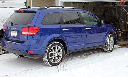 blue colored SUV car on parking