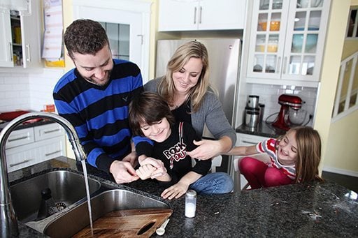whole family having fun in the kitchen sink