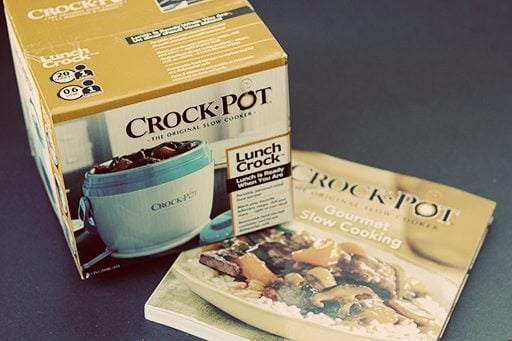 Box of crock pot and a cook book