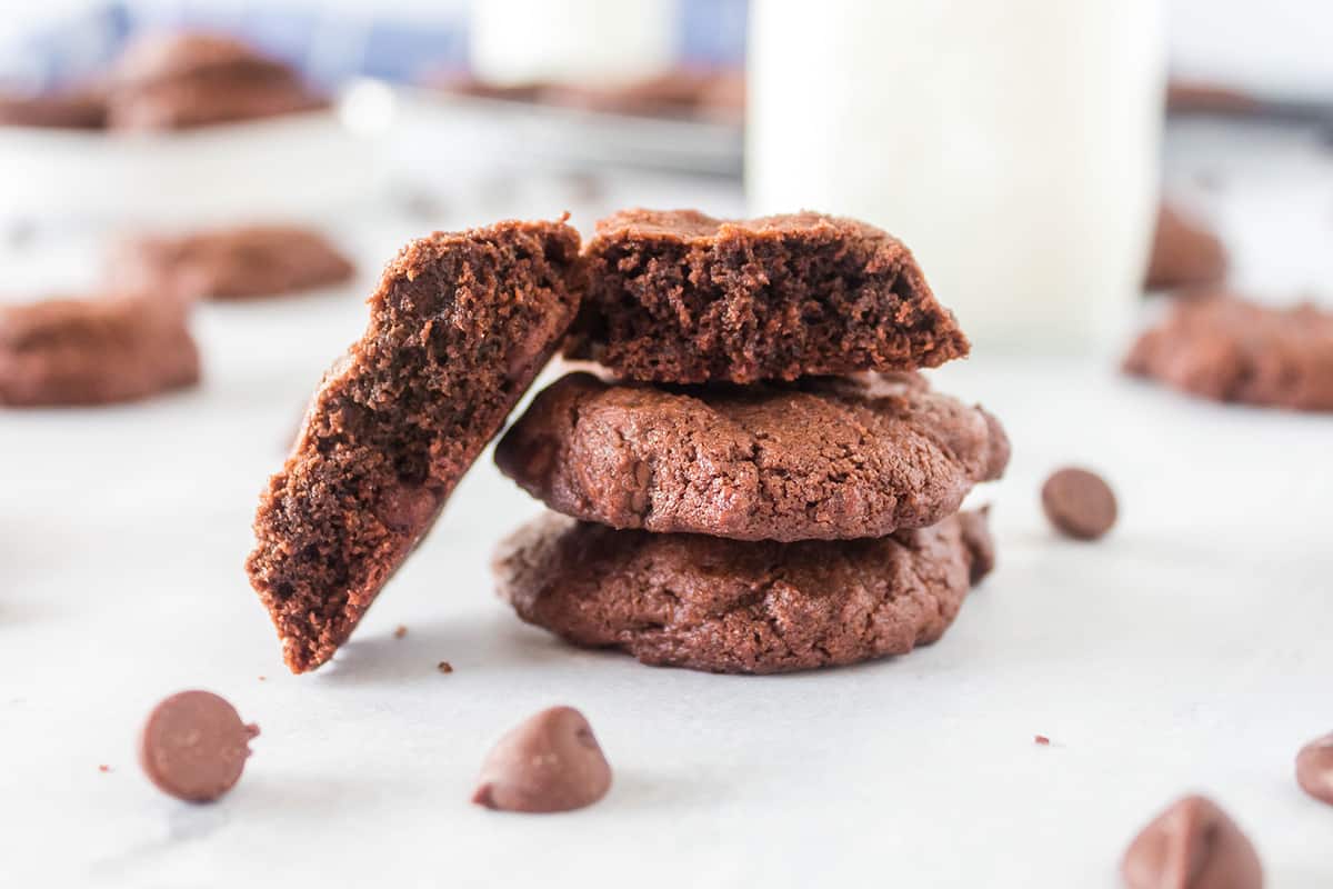 stack of mint chocolate chip cookies with parchment paper in between