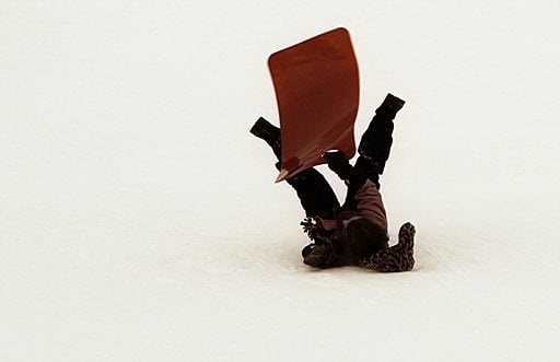 kid stumble in sled