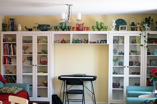 The reading room with the piano and the display kitchen glasswares