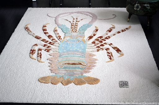 close up of white lobster rug in the room