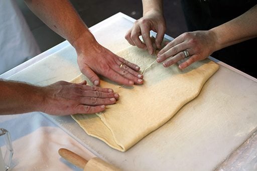 dough is folded into a square with the rolled out butter inside it