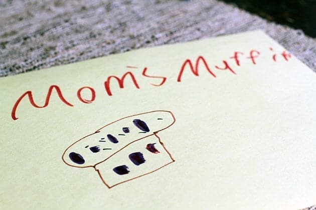 writing in a piece of paper of "Mom's Muffin" and a drawing of muffin below it