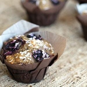 close up of Cherry Coconut Whole Wheat Muffins with Brown Muffin Liners