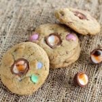 Three pieces leftover Easter Candy Cookies in fiber cloth background