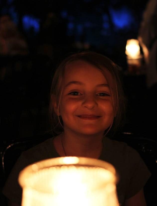 close up of young girl near the light