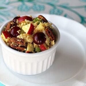 Curried Chicken Quinoa Salad in a White Ramekins over White plate