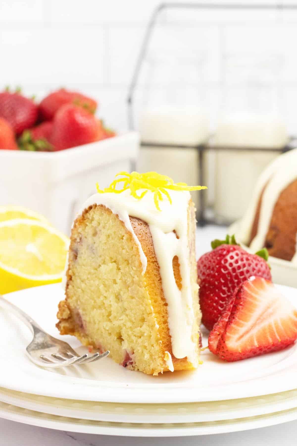 Strawberry Bundt Cake cleave on a white plate  Lemon Strawberry Bundt Cake StrawberryBundtCakeslice 1200x1800