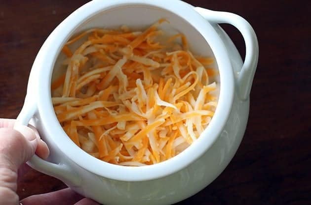 shredded cheese in a ceramic bowl