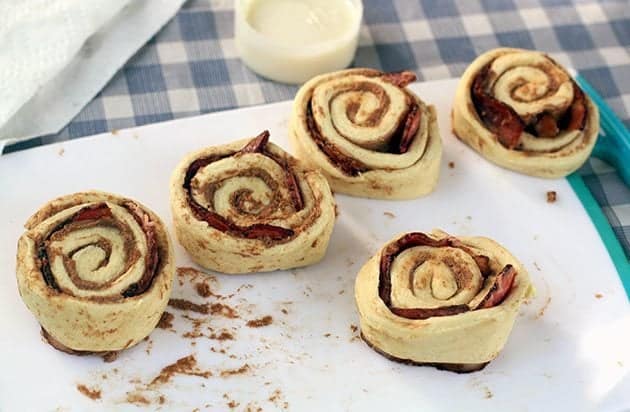 rolled back cinnamon buns with dough pinched to seal it up