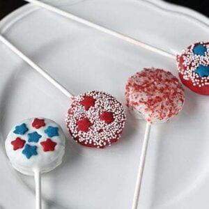 Patriotic color Oreo Cookie Pops with stick in a white plate