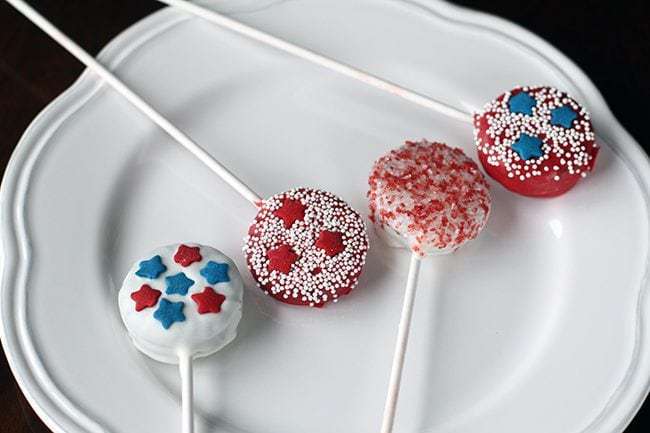 Patriotic color Oreo Cookie Pops with stick in a white plate