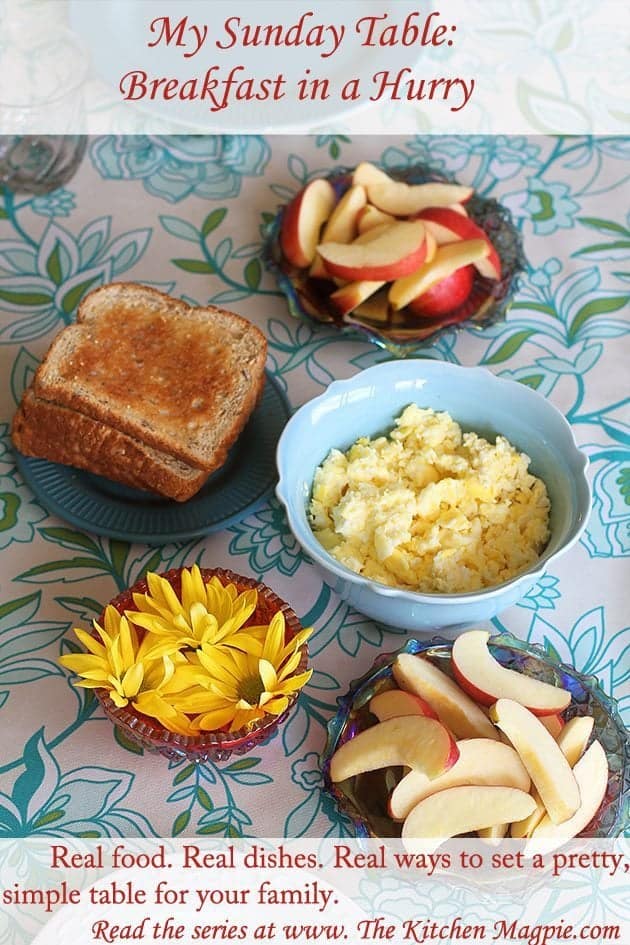 top down shot of scrambled eggs, whole grain toast and sliced organic gala apples in the table for Sunday breakfast