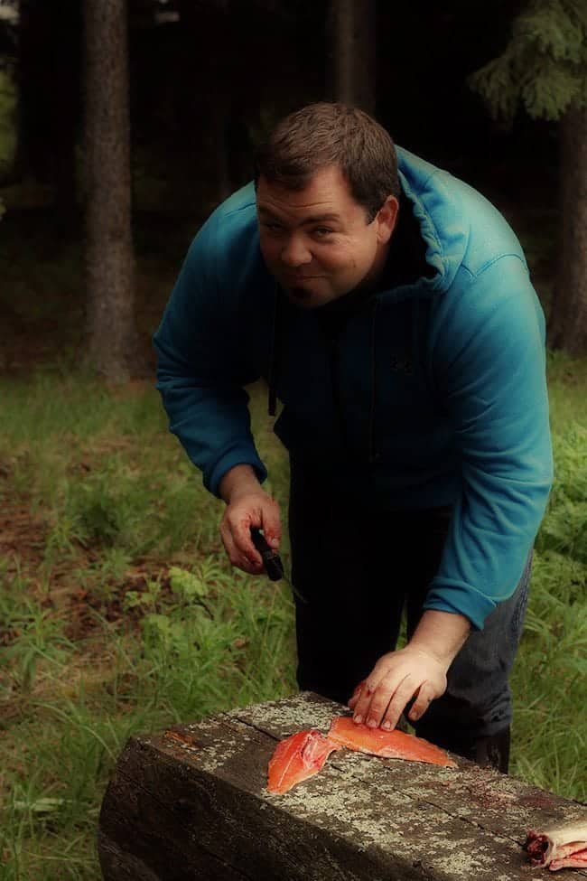 man cleaning and preparing the brook trout