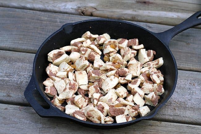 chopped up cinnamon buns in a skillet