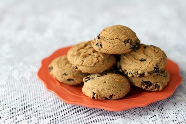 Raisin Molasses Gems in an orange plate on a white background