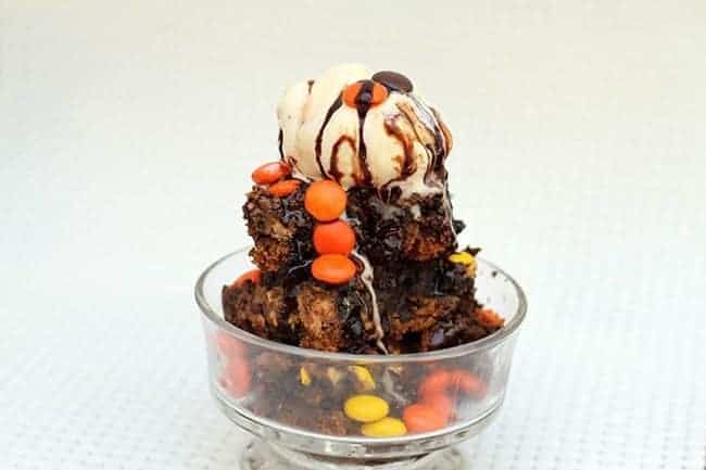Peanut Butter Chocolate Chip Cookie Skillet Brownie Bars with a Scoop of Ice Cream on Top