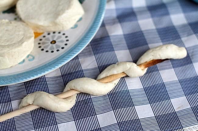 wrapped biscuit dough around a wooden stick