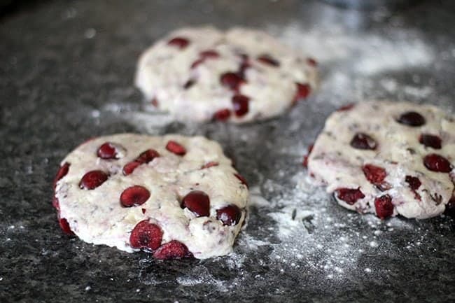 three parts of Chocolate Cherry Scones dough flattened 