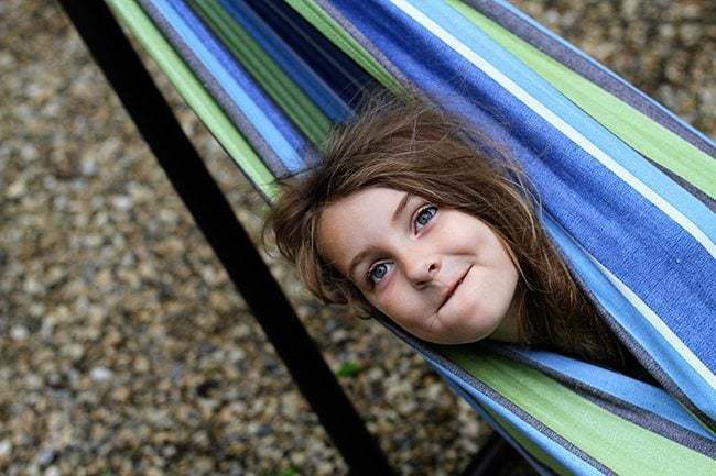 young girl in the hammock showing only her head