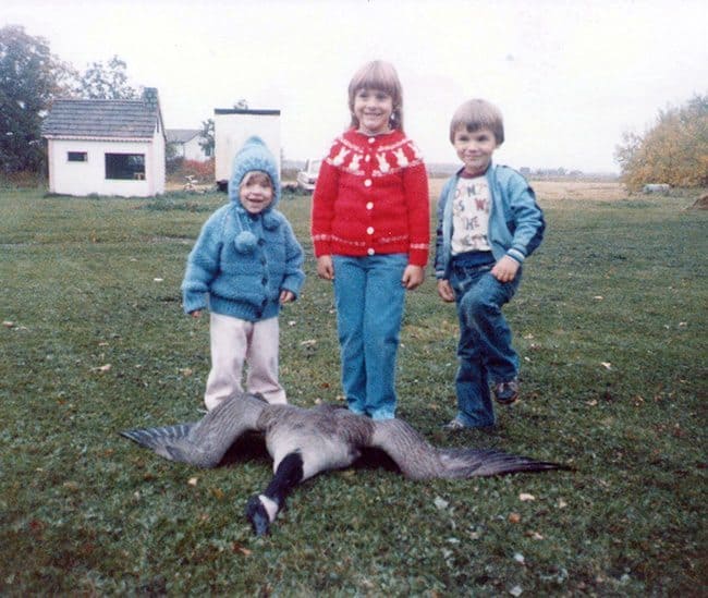 a fallen duck in front of tree little kids