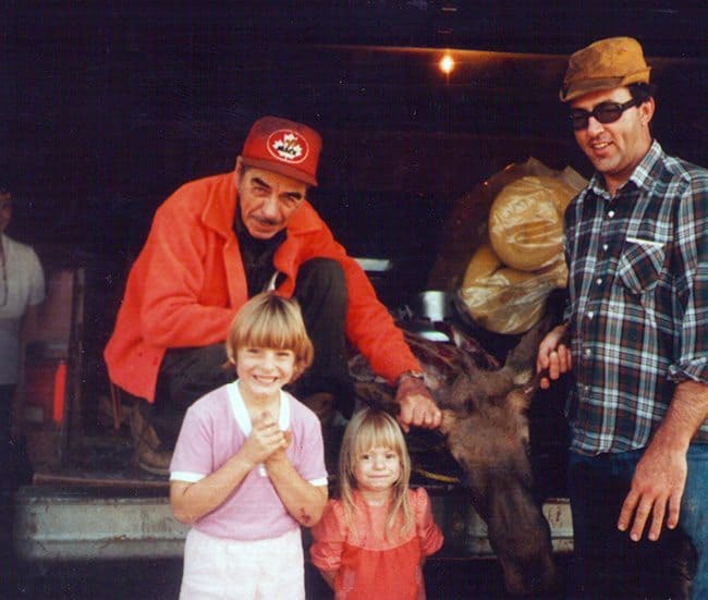 old photo of hunting men with the two kids