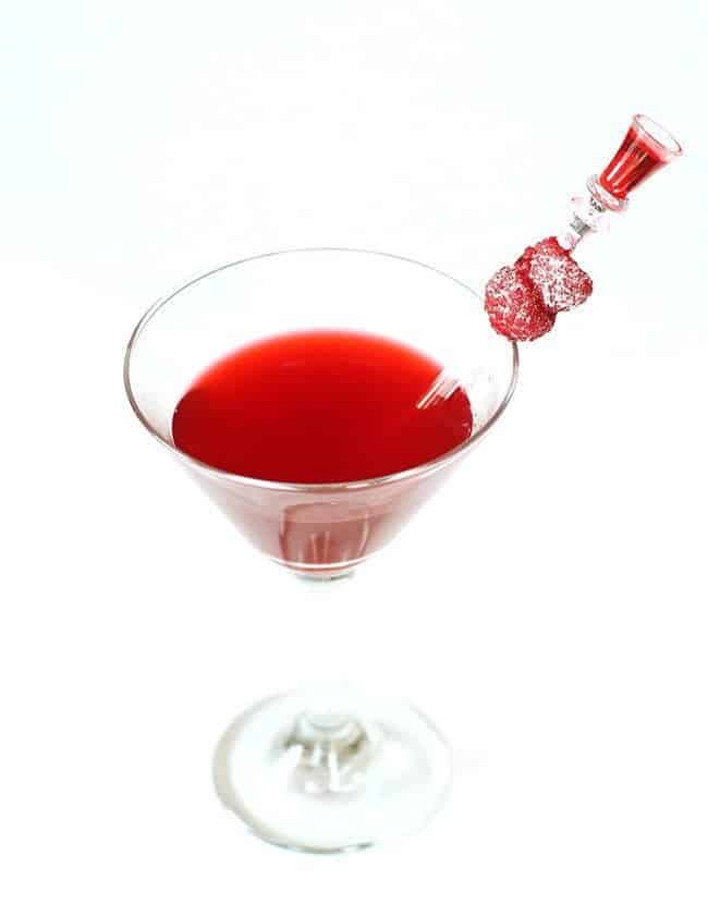 top down shot of A glass of Raspberry Cordial Vodka Martini in White Background