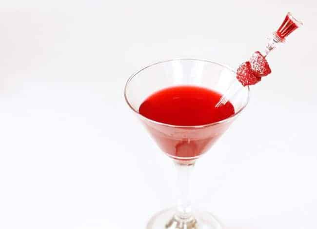 A glass of Raspberry Cordial Vodka Martini in White Background