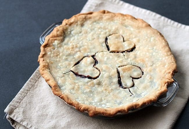 whole saskatoon pie in a Pyrex pie plate