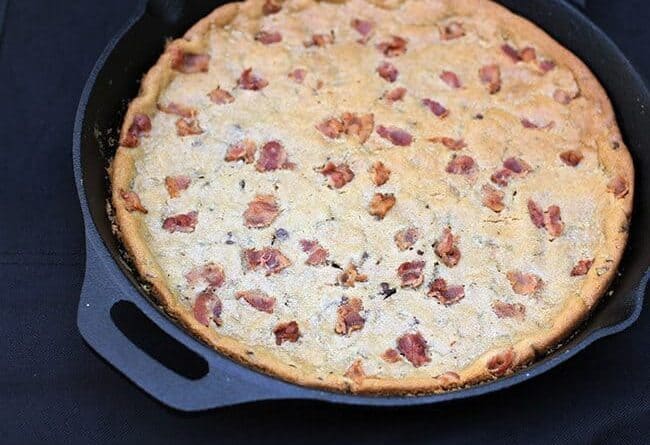 close up giant Chocolate Chip Cookie with bacon in a large Skillet