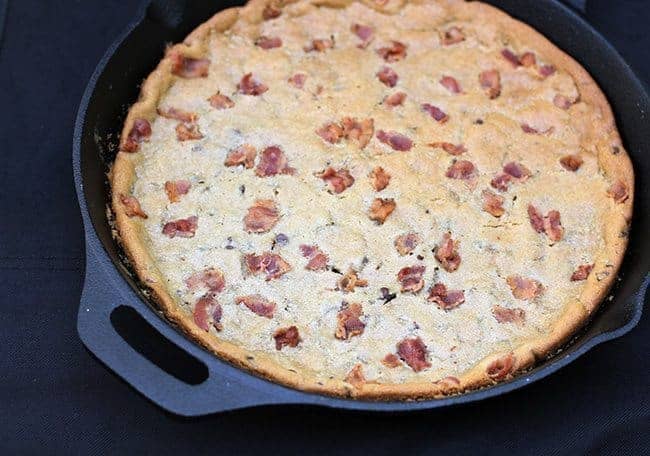 close up giant Chocolate Chip Cookie with bacon in a large Skillet