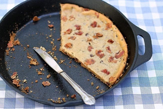 skillet with the knife and the remaining cookie after eating